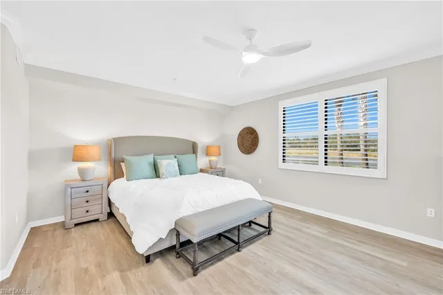 a bedroom with a large bed and a window