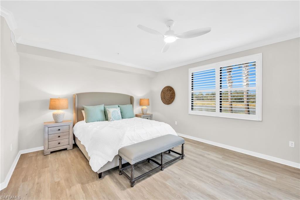 3159 Serena Lane, Unit 102 Naples, FL 34114 - Photo 21 of 42 a bedroom with a bed and window