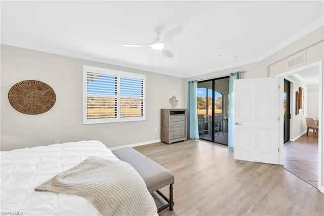 a bedroom with a bed and a night stand