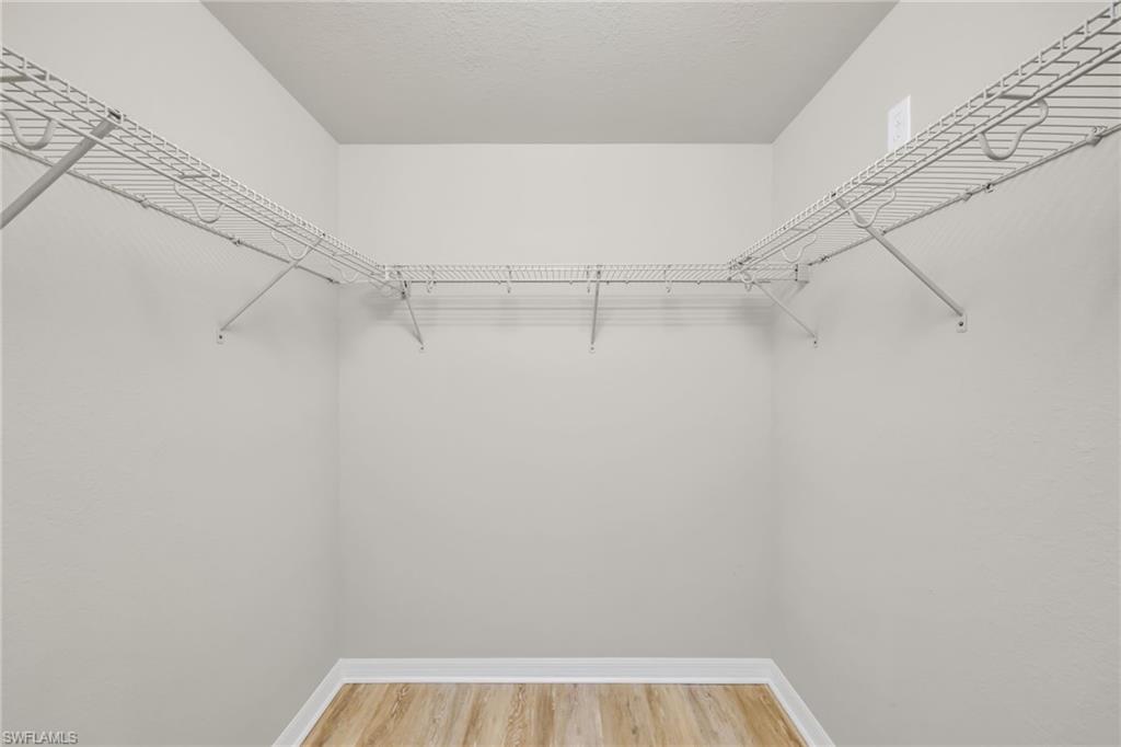 3159 Serena Lane, Unit 102 Naples, FL 34114 - Photo 25 of 42 a view of small space with racks on the wall