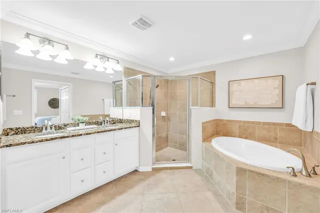 a bathroom with a tub and a shower