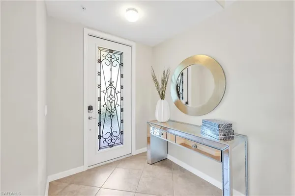 a bathroom with a mirror a sink and a mirror