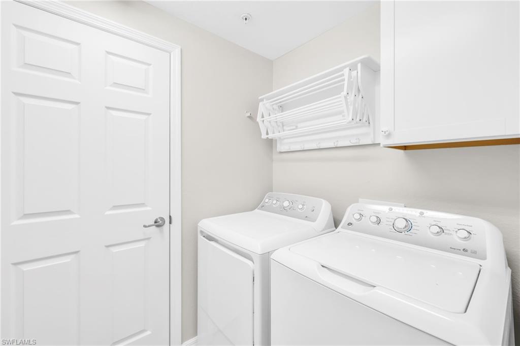 3159 Serena Lane, Unit 102 Naples, FL 34114 - Photo 32 of 42 a utility room with dryer and washer