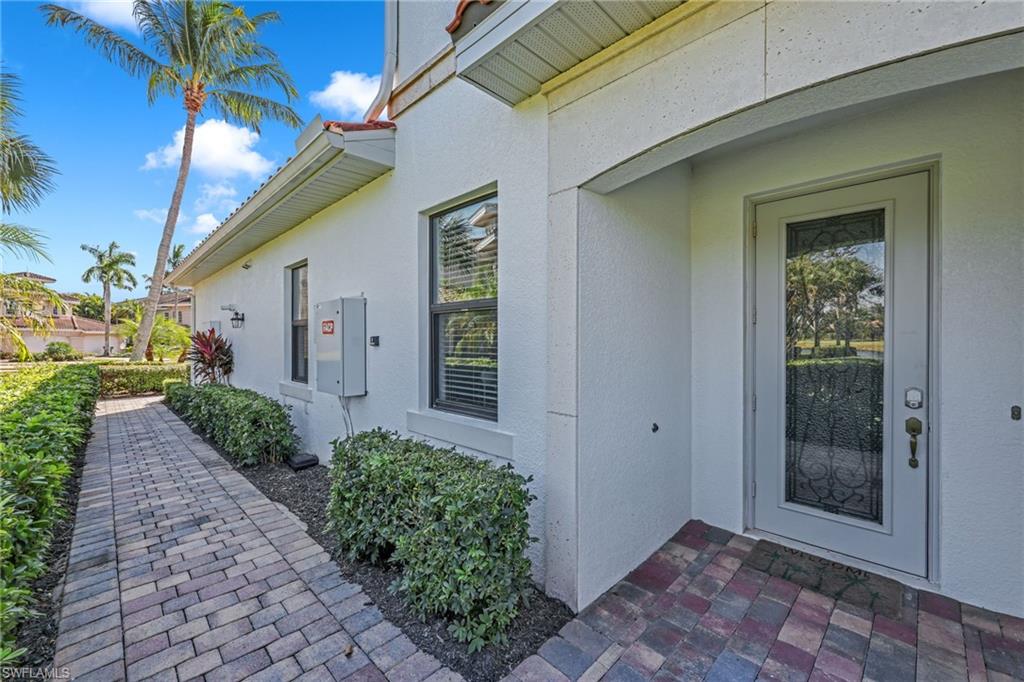3159 Serena Lane, Unit 102 Naples, FL 34114 - Photo 33 of 42 a view of a pathway both side of house