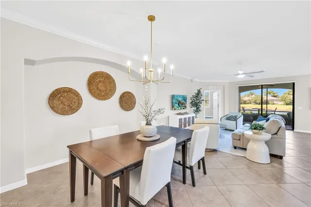 a view of a dining room and a large window