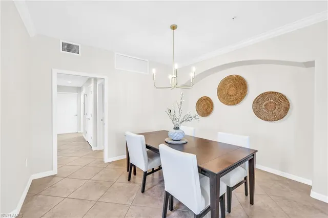 a view of a dining room and a table and chairs