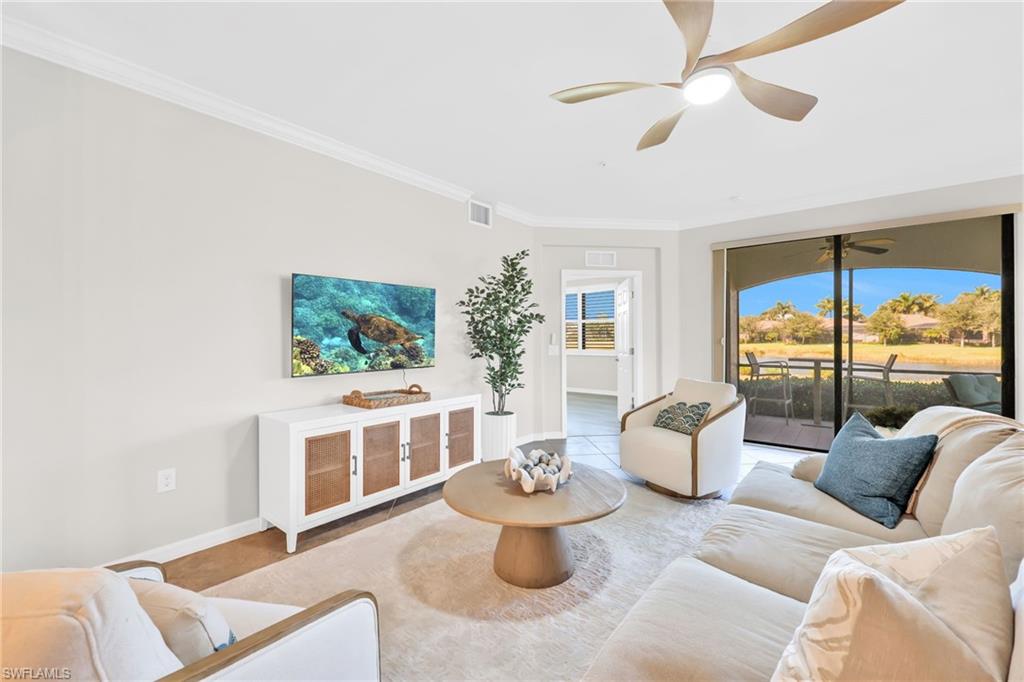 3159 Serena Lane, Unit 102 Naples, FL 34114 - Photo 7 of 42 a living room with furniture and a large window