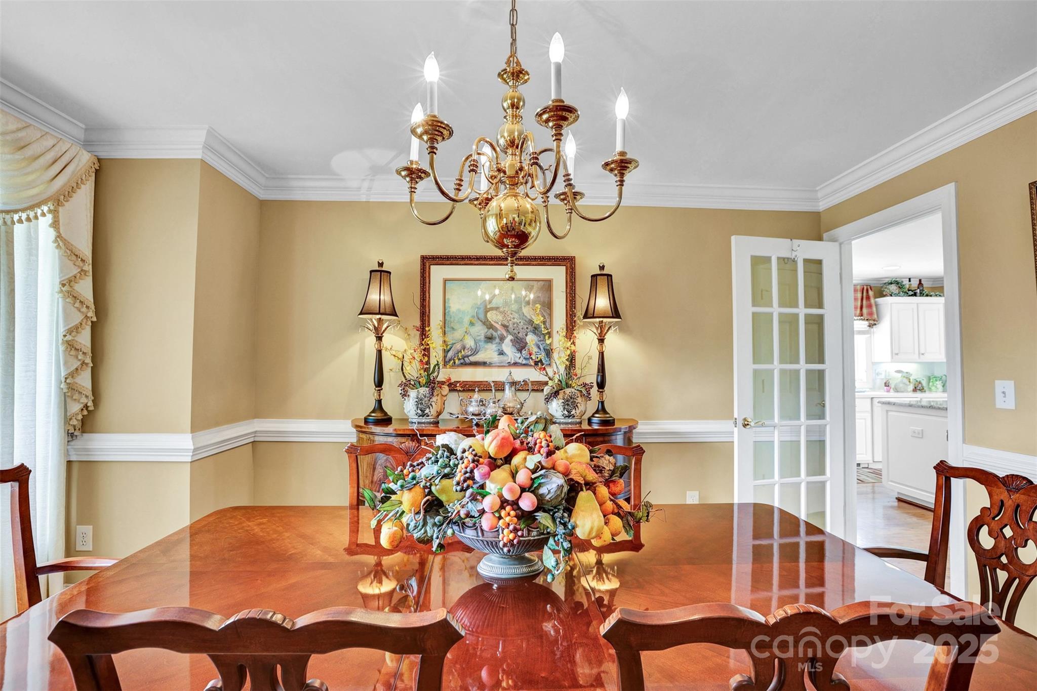 25683 April Lane Albemarle, NC 28001 - Photo 16 of 42 a view of a dining room with furniture a chandelier and a large window