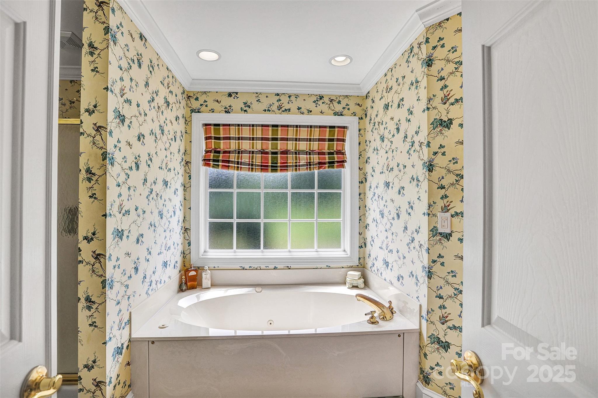 25683 April Lane Albemarle, NC 28001 - Photo 21 of 42 a bathroom with a bathtub and window