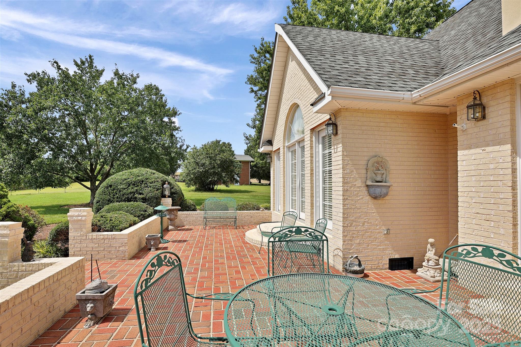 25683 April Lane Albemarle, NC 28001 - Photo 36 of 42 a view of a patio with couches table and chairs and potted plants