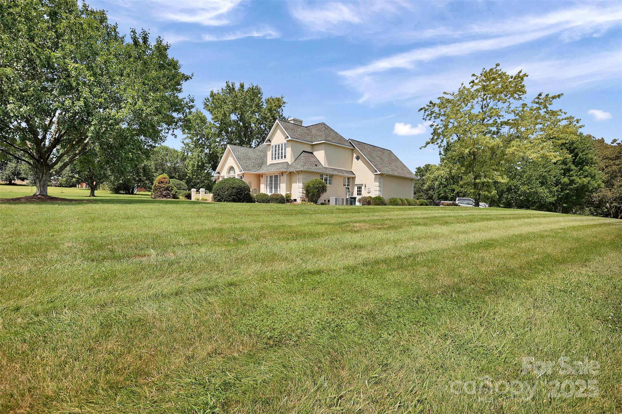 25683 April Lane Albemarle, NC 28001 - Photo 4 of 42 a front view of a house with a yard
