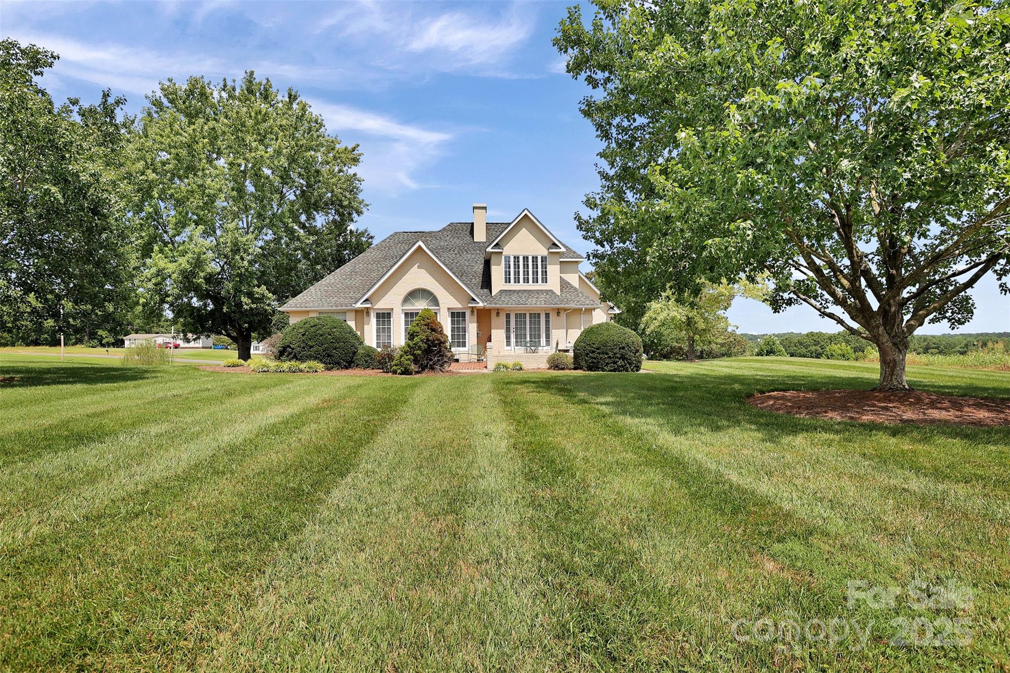 25683 April Lane Albemarle, NC 28001 - Photo 5 of 42 a front view of a house with yard and green space