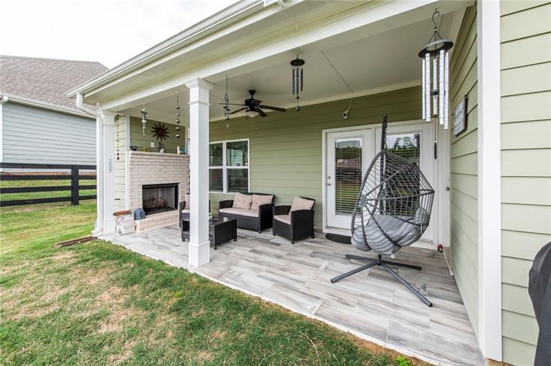 98 Heritage Pointe Drive Villa Rica, GA 30180 - Photo 14 of 48 a view of a chair and table in backyard of house