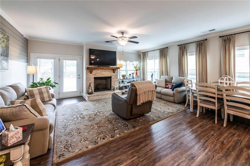 98 Heritage Pointe Drive Villa Rica, GA 30180 - Photo 17 of 48 a living room with furniture fireplace and flat screen tv
