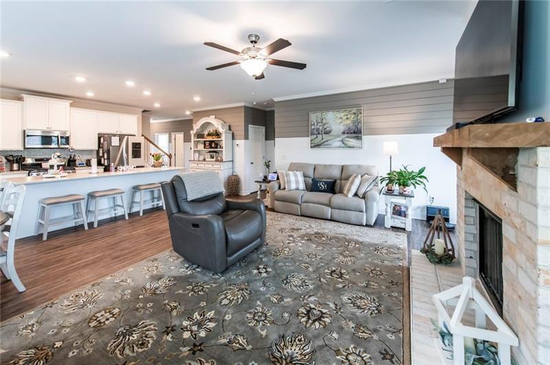 98 Heritage Pointe Drive Villa Rica, GA 30180 - Photo 19 of 48 a living room with furniture and a fireplace
