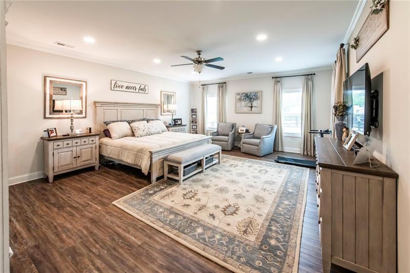 98 Heritage Pointe Drive Villa Rica, GA 30180 - Photo 27 of 48 a bedroom with bed and a flat screen tv