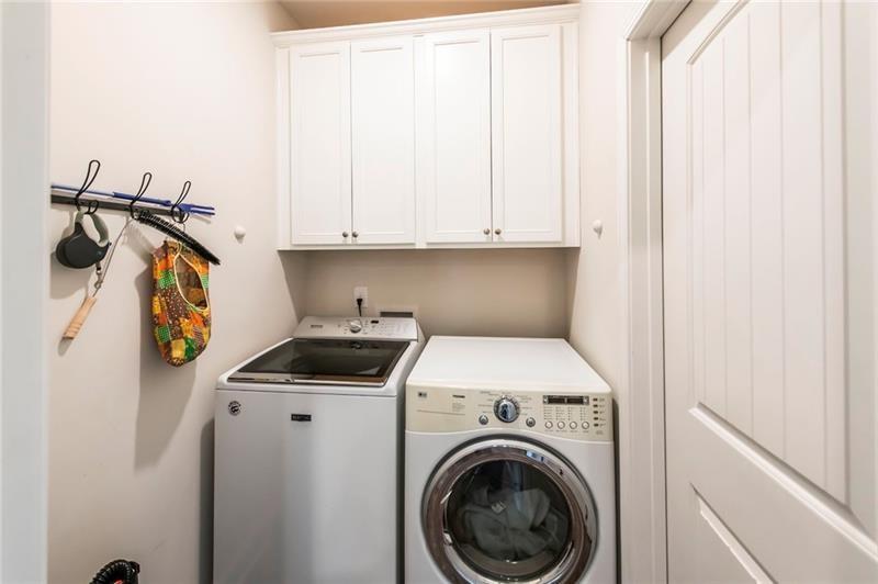 98 Heritage Pointe Drive Villa Rica, GA 30180 - Photo 32 of 48 a view of storage and utility room with washer and dryer