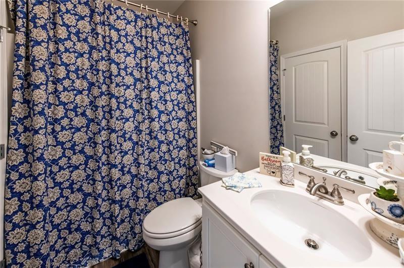 98 Heritage Pointe Drive Villa Rica, GA 30180 - Photo 33 of 48 a bathroom with a sink and a toilet