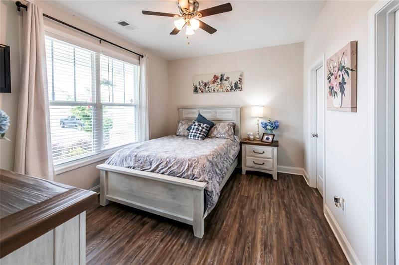 98 Heritage Pointe Drive Villa Rica, GA 30180 - Photo 37 of 48 a bedroom with a large bed and a window