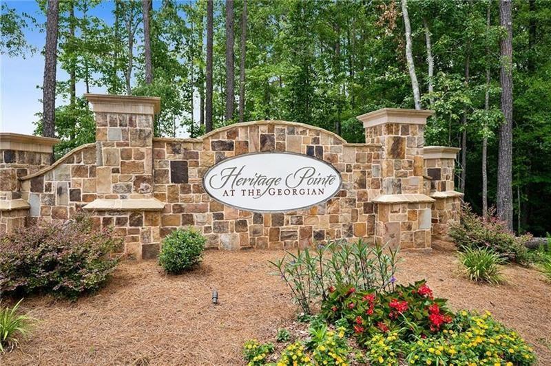 98 Heritage Pointe Drive Villa Rica, GA 30180 - Photo 43 of 48 a front view of a house with garden