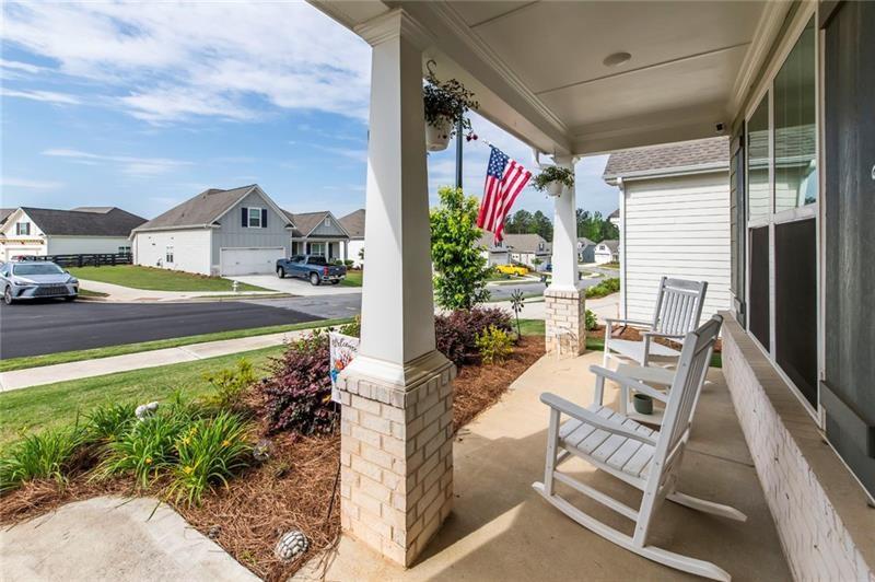 98 Heritage Pointe Drive Villa Rica, GA 30180 - Photo 5 of 48 a view of an chairs and tables in the balcony