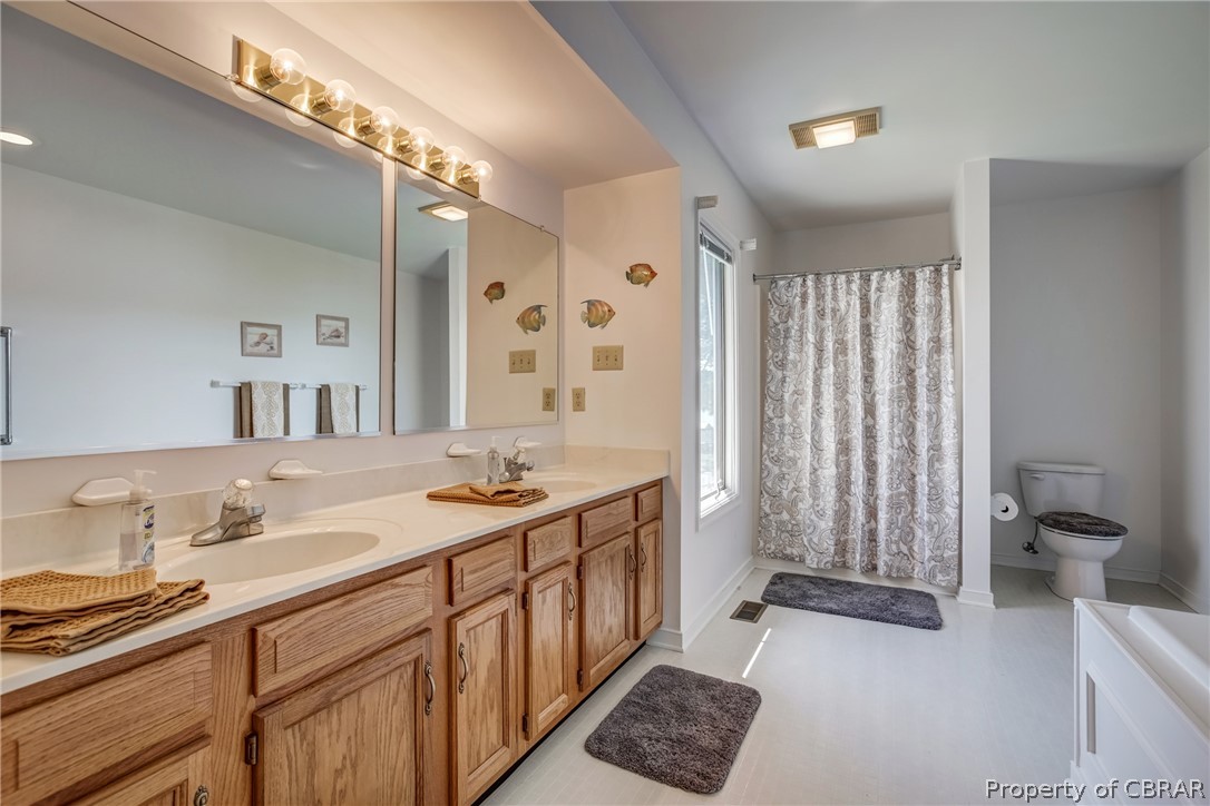 546 Eubank Landing Road Topping, VA 23169 - Photo 27 of 40 Large master bathroom with double vanity