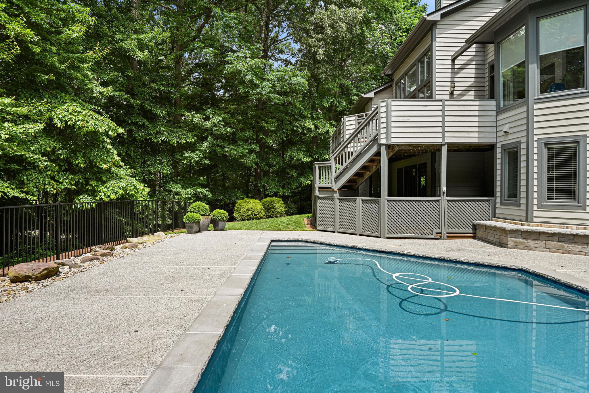 11217 Bright Pond Lane Reston, VA 20194 - Photo 61 of 72 View of the backyard from the pool