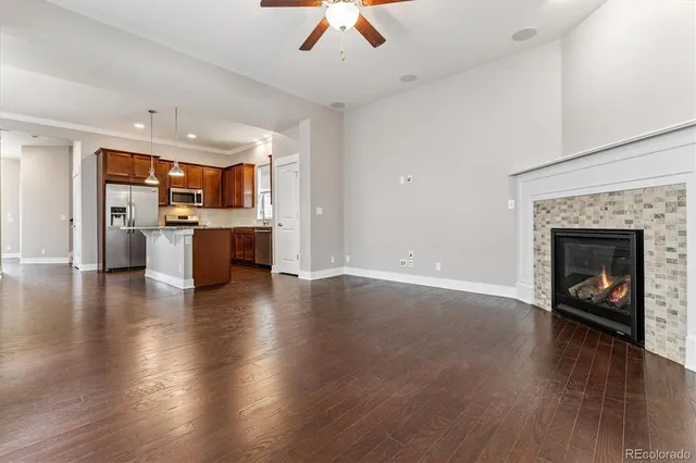 an open kitchen with furniture and a fireplace
