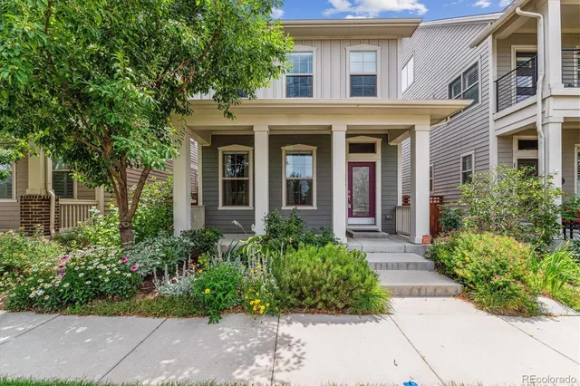front view of a brick house with a large windows