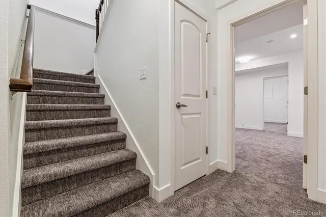 a view of a hallway with staircase