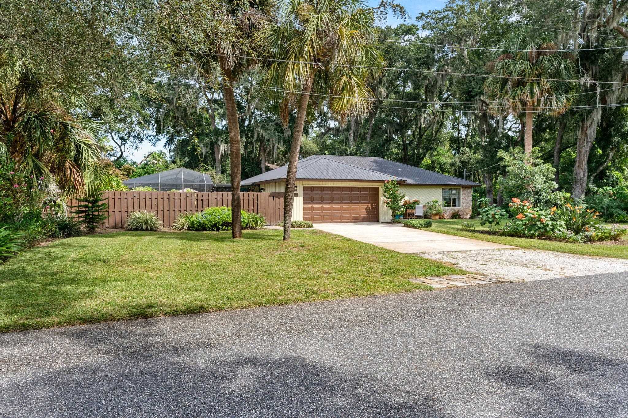 117 Seminole Road St. Augustine, FL 32086 - Photo 2 of 47 a front view of a house with garden