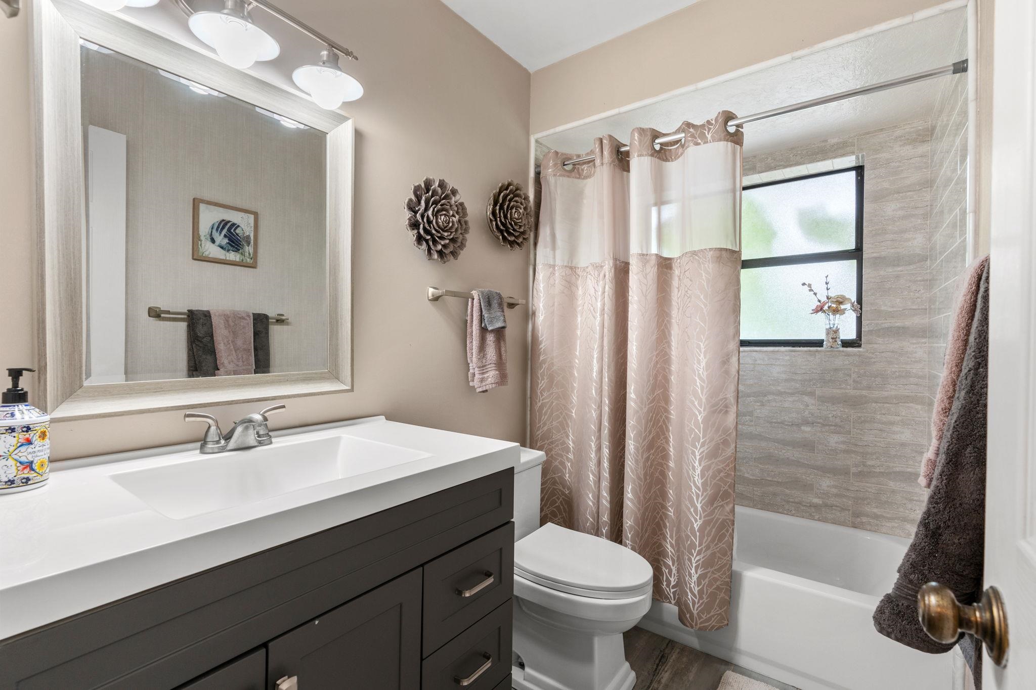117 Seminole Road St. Augustine, FL 32086 - Photo 23 of 47 a bathroom with a sink toilet and shower