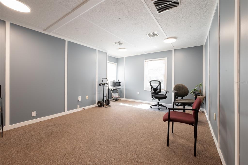 1813 North Dean Road Orlando, FL 32817 - Photo 12 of 35 a view of a room with gym equipment and a large window