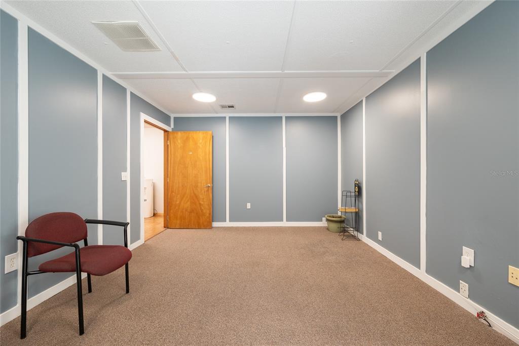 1813 North Dean Road Orlando, FL 32817 - Photo 13 of 35 a view of a livingroom with a chair and a window