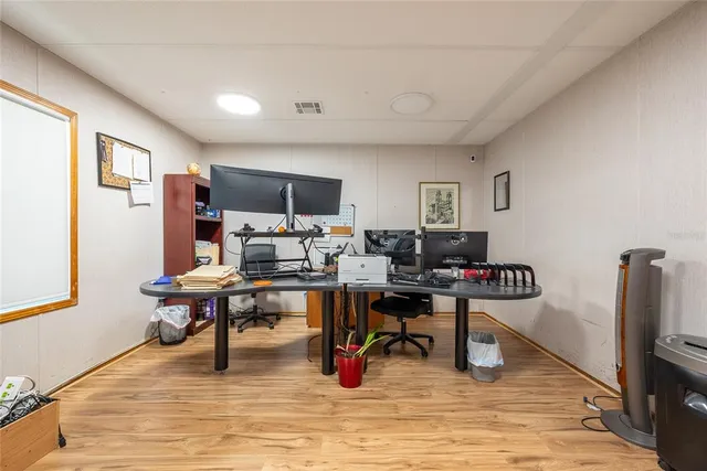 a view of a workspace with furniture