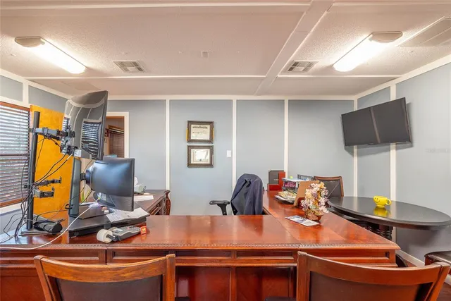 a view of a workspace with furniture