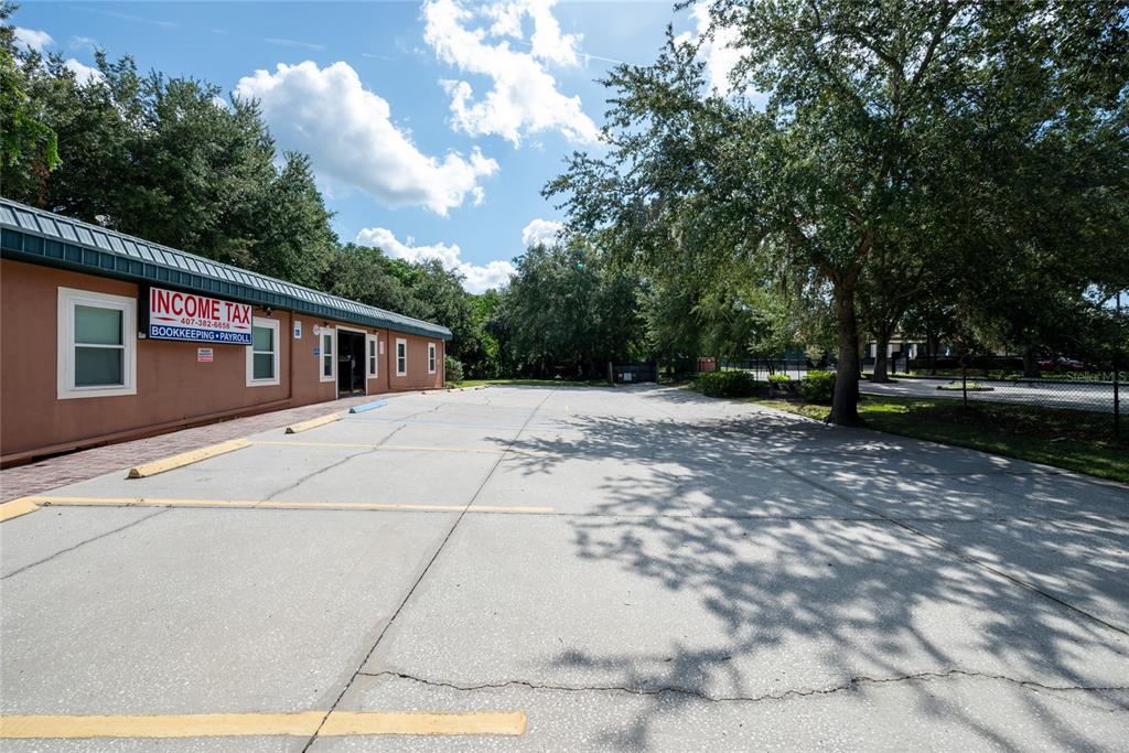 1813 North Dean Road Orlando, FL 32817 - Photo 3 of 35 a front view of a house with a yard