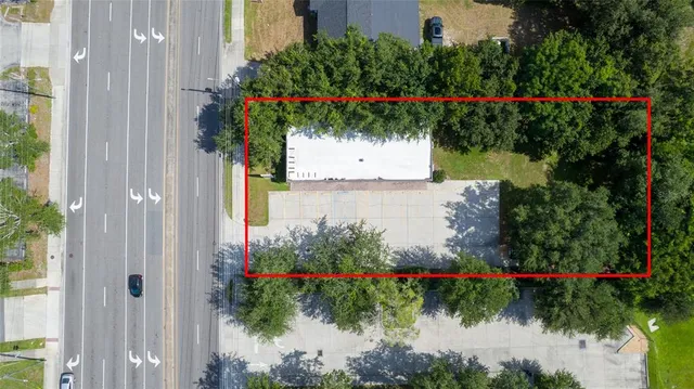 a view of a flower arrangement in backyard of a house