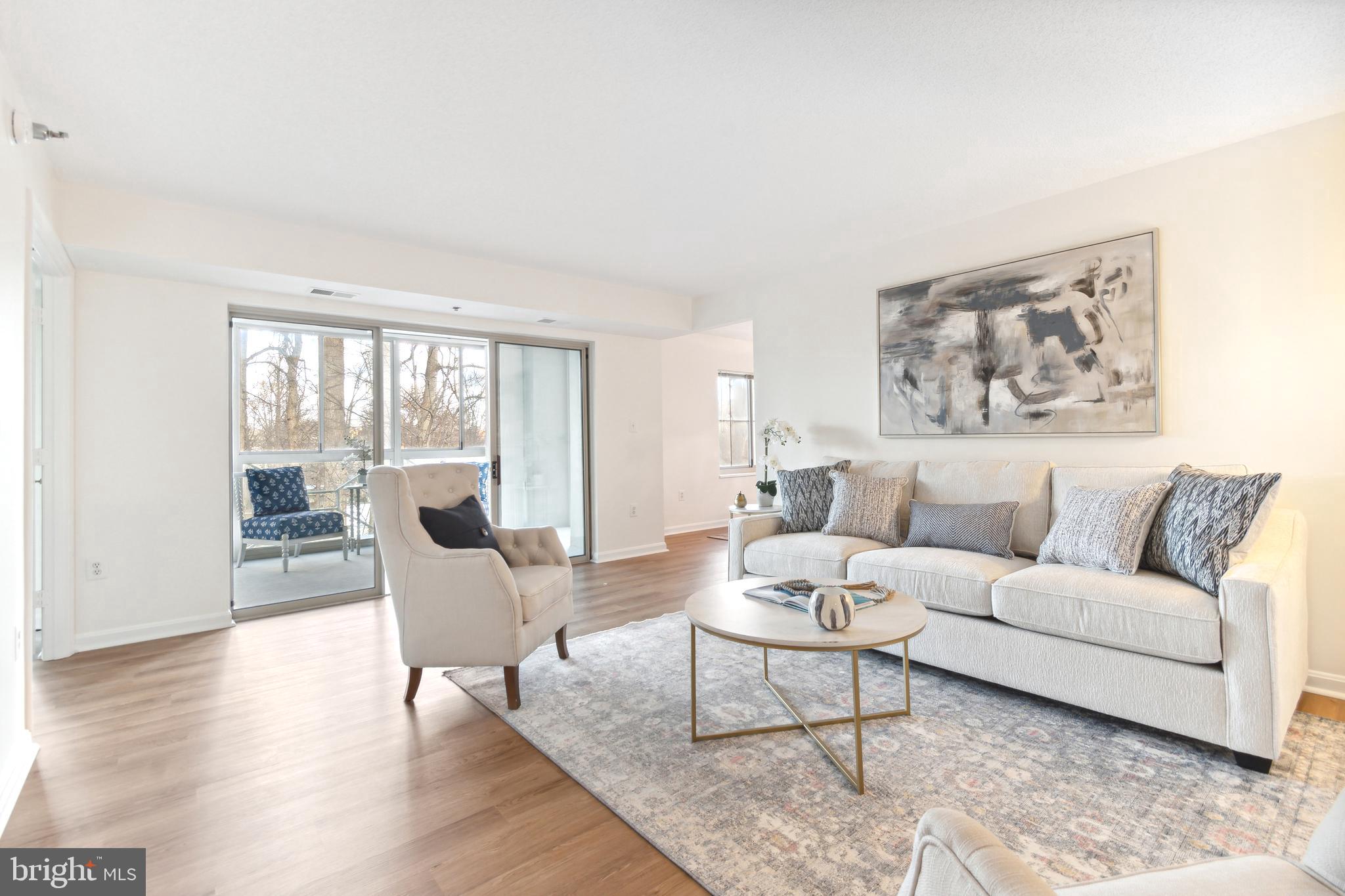 14809 Pennfield Circle, Unit 304 Silver Spring, MD 20906 - Photo 6 of 29 Living room overlooks sun room