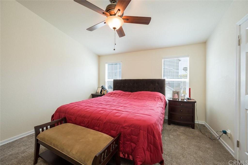 2531 Cienaga Street, Unit 3 Oceano, CA 93445 - Photo 12 of 18 a bedroom with a bed and a table