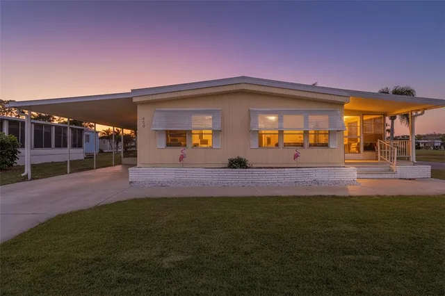 a view of a house with a backyard porch and sitting area