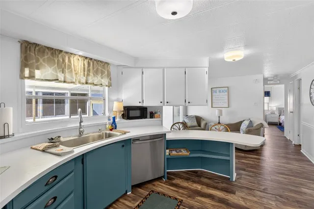 a white refrigerator freezer sitting inside of a kitchen