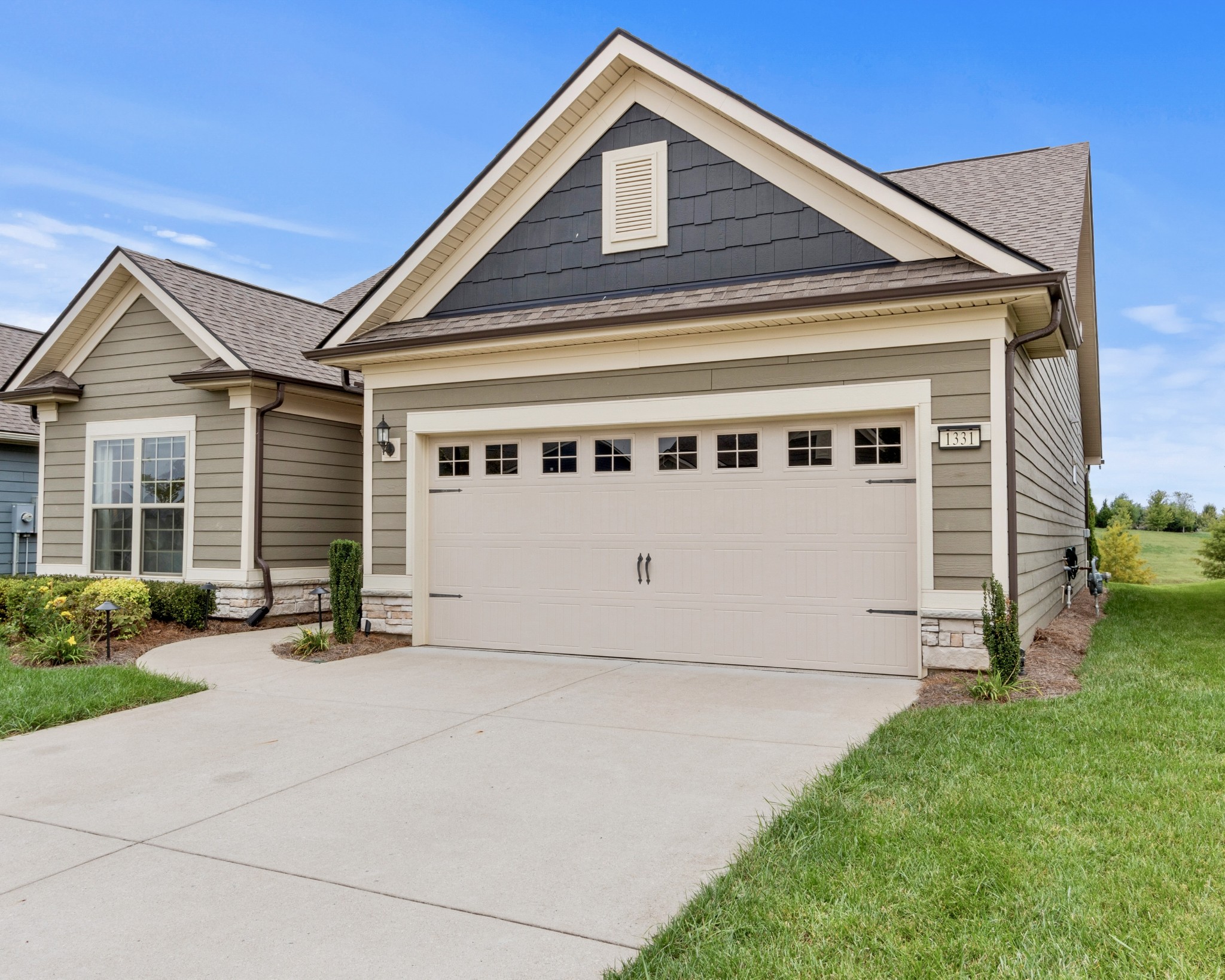 1331 Madison Lane Spring Hill, TN 37174 - Photo 1 of 61 a front view of a house with a yard and garage