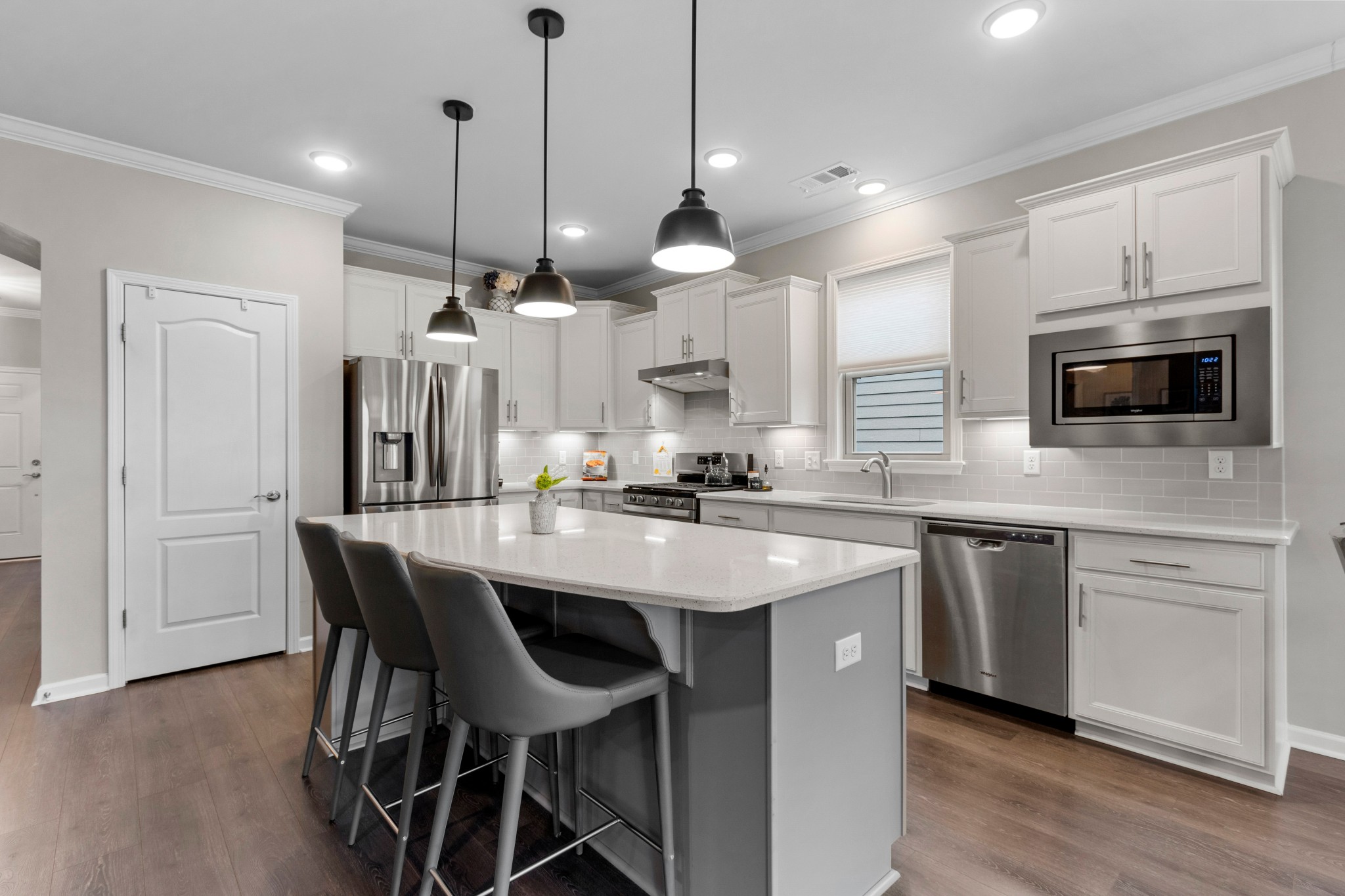 1331 Madison Lane Spring Hill, TN 37174 - Photo 11 of 61 a kitchen with stainless steel appliances kitchen island a large island in the center