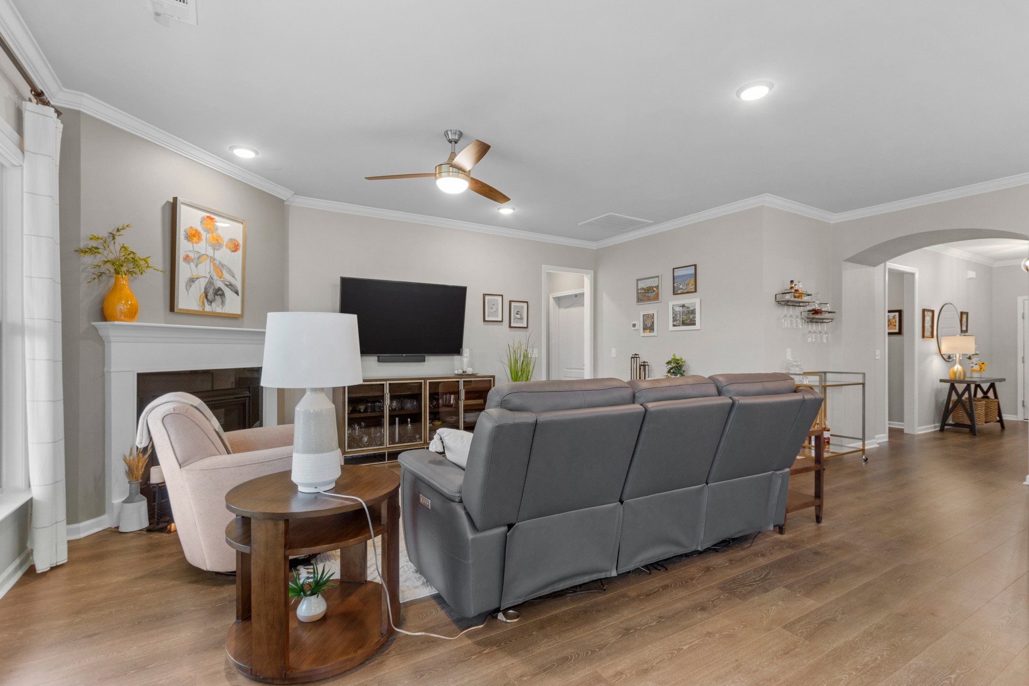 1331 Madison Lane Spring Hill, TN 37174 - Photo 20 of 61 a living room with furniture a flat screen tv and kitchen view
