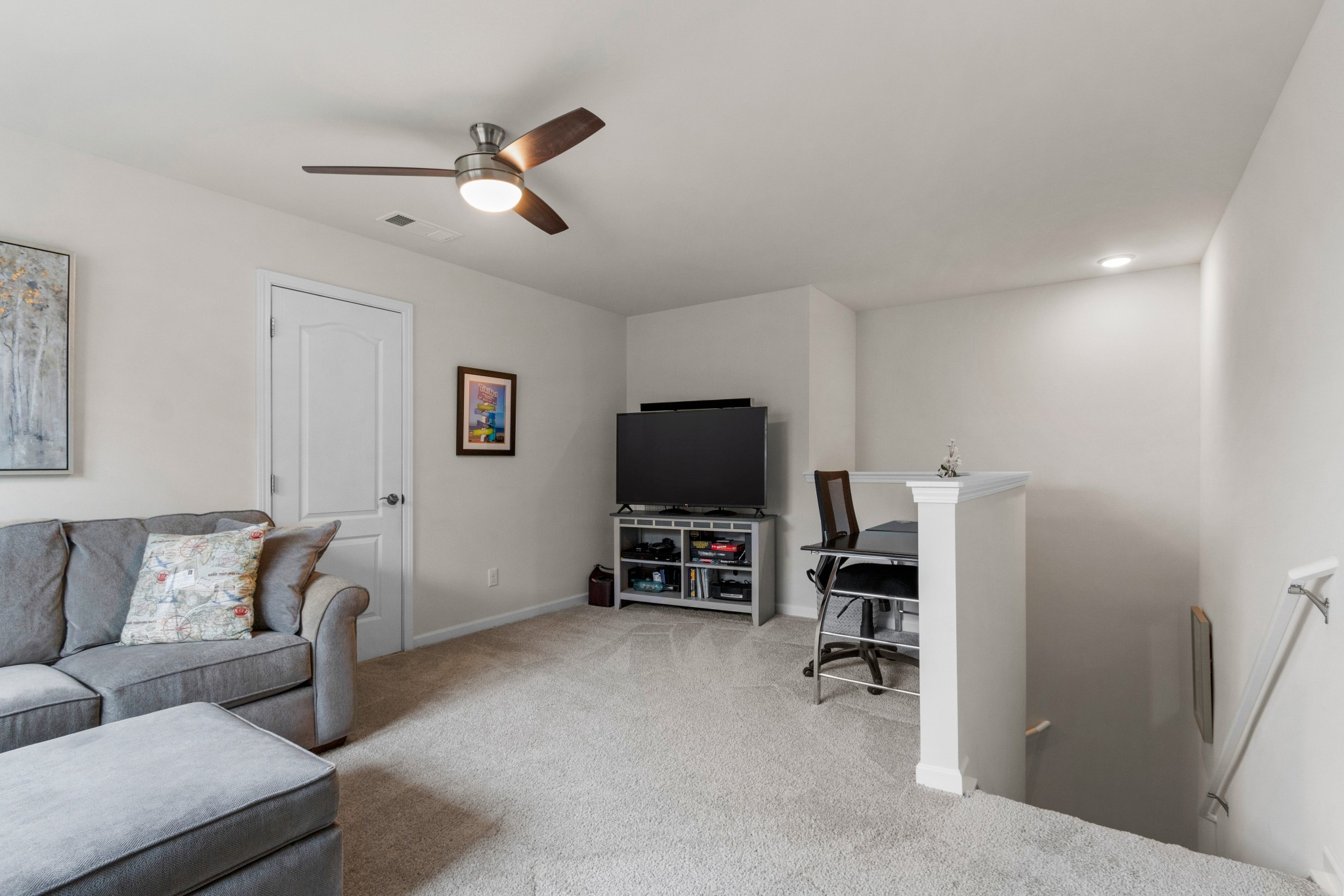 1331 Madison Lane Spring Hill, TN 37174 - Photo 35 of 61 a living room with furniture and a flat screen tv