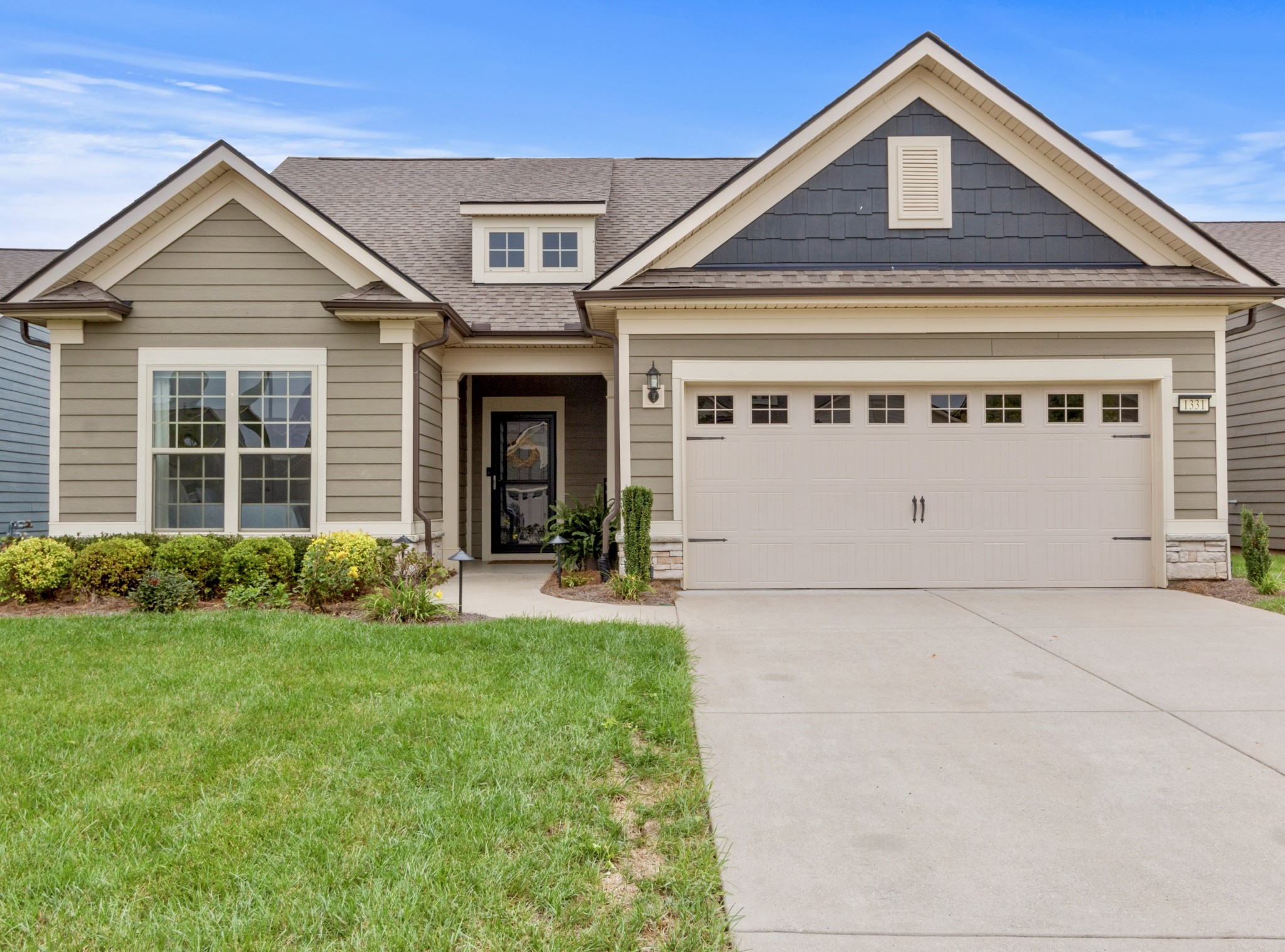 1331 Madison Lane Spring Hill, TN 37174 - Photo 45 of 61 a front view of a house with a yard and garage