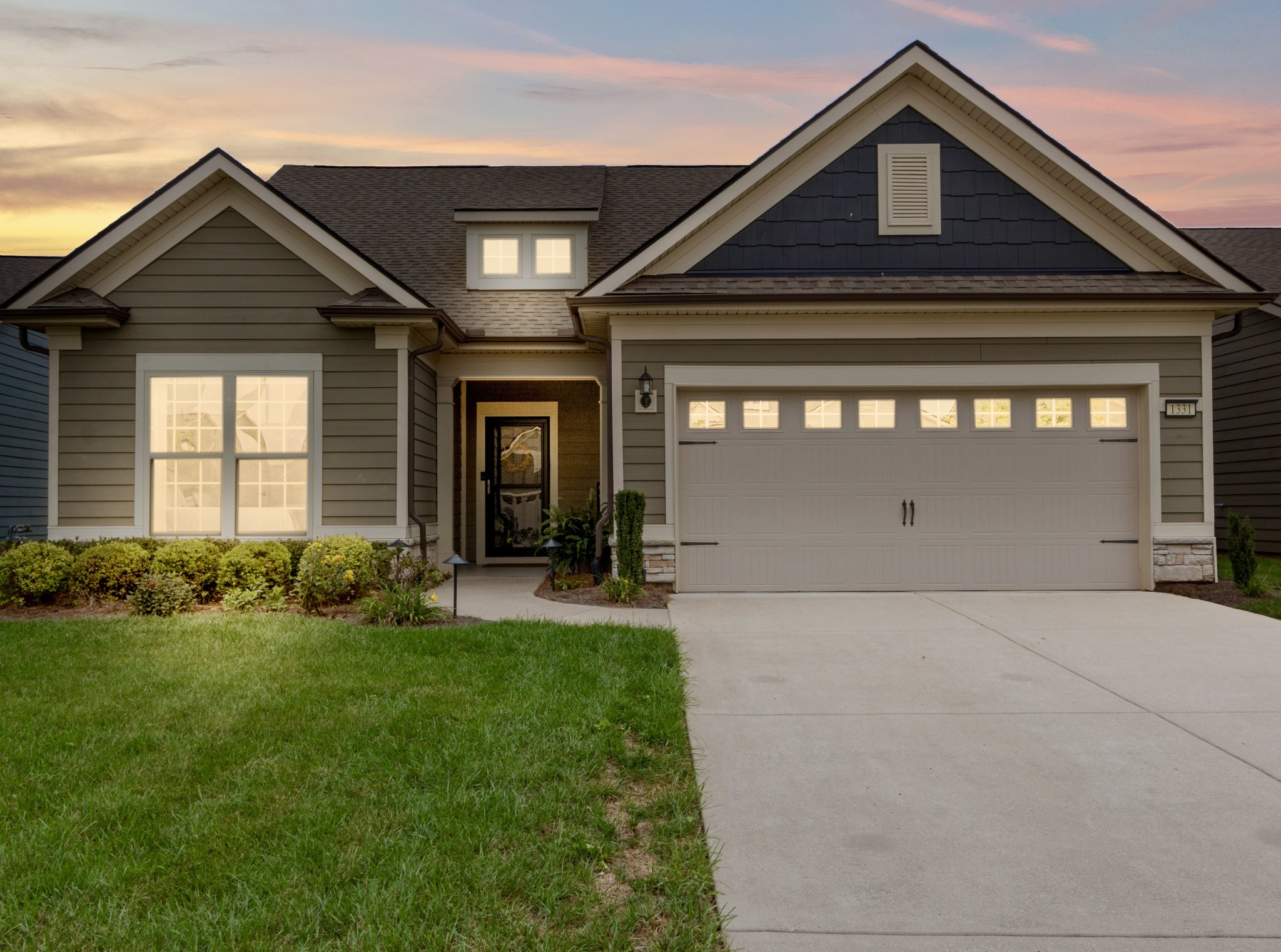 1331 Madison Lane Spring Hill, TN 37174 - Photo 46 of 61 a front view of a house with garden