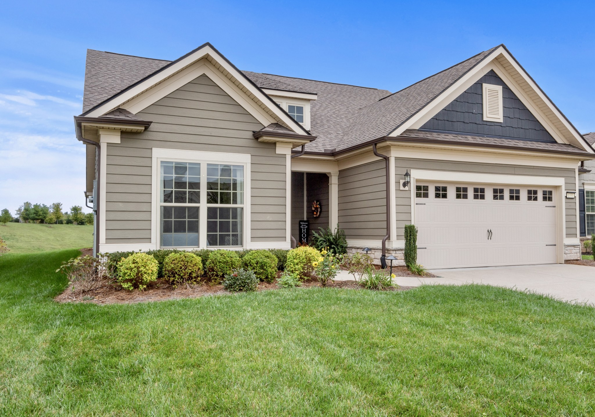 1331 Madison Lane Spring Hill, TN 37174 - Photo 5 of 61 a front view of a house with garden
