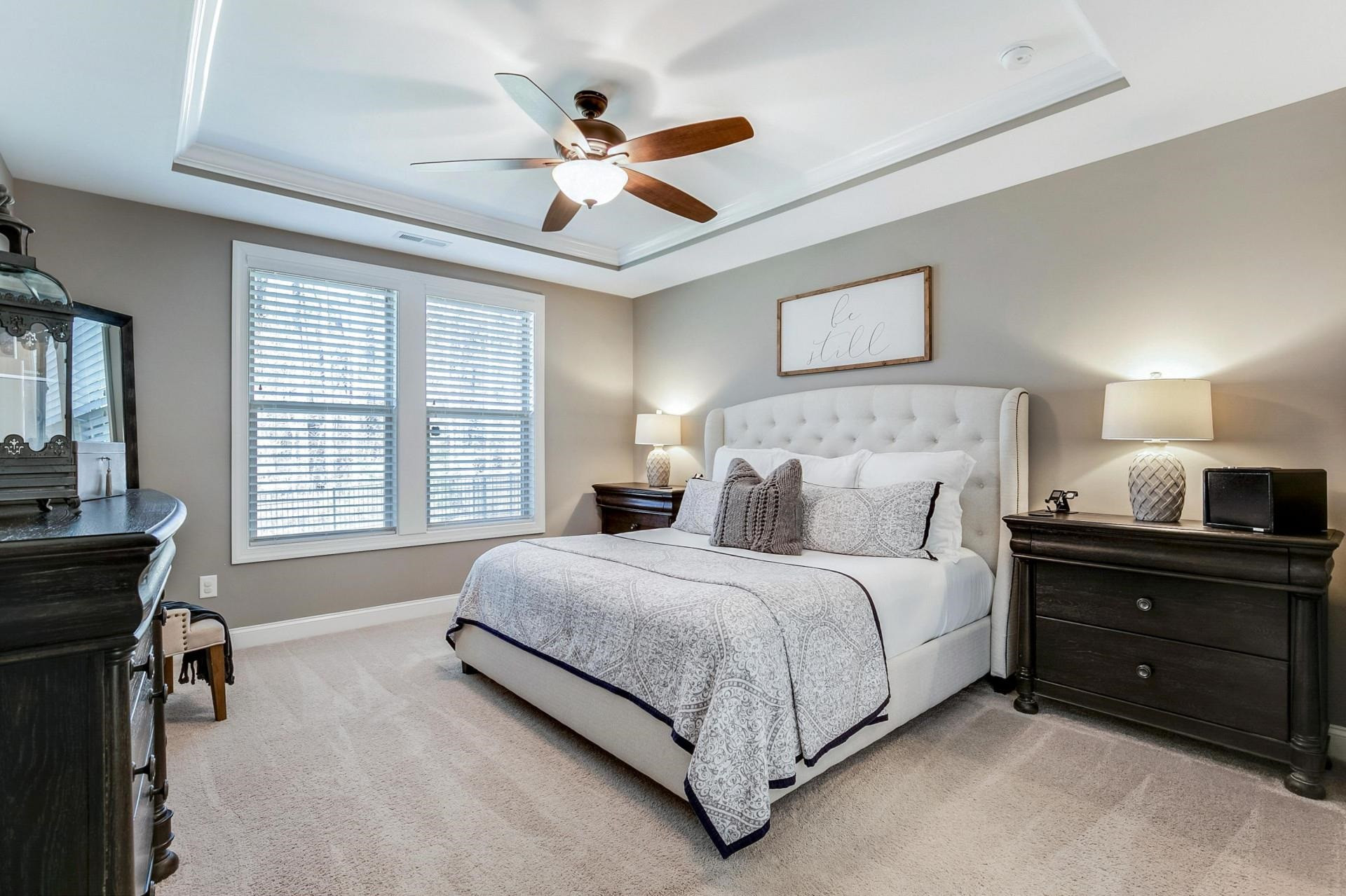 1016 Capstone Drive Durham, NC 27713 - Photo 18 of 50 a bedroom with a bed and a chandelier